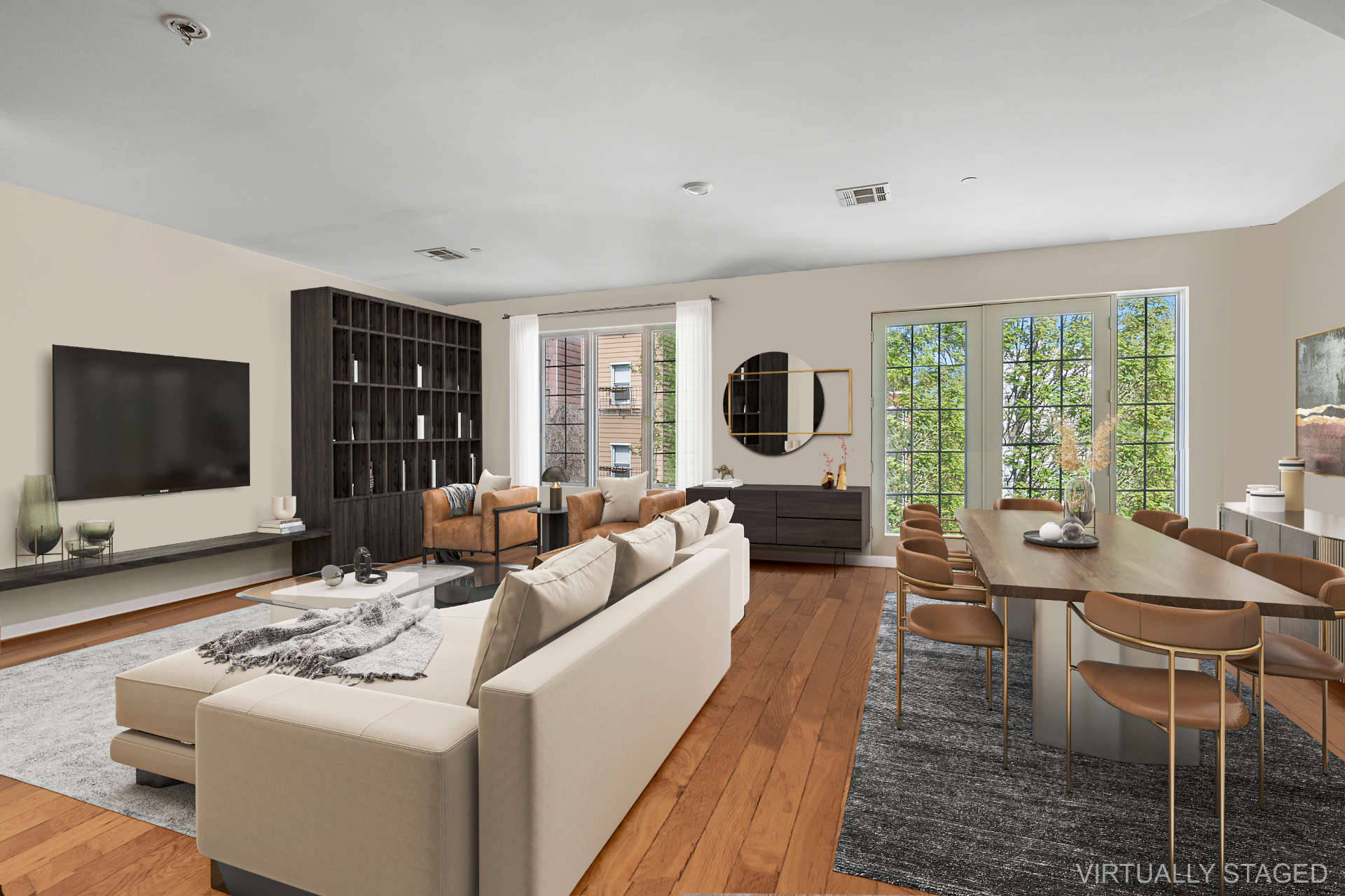 Staged open-concept living and dining room on Manhattan Avenue