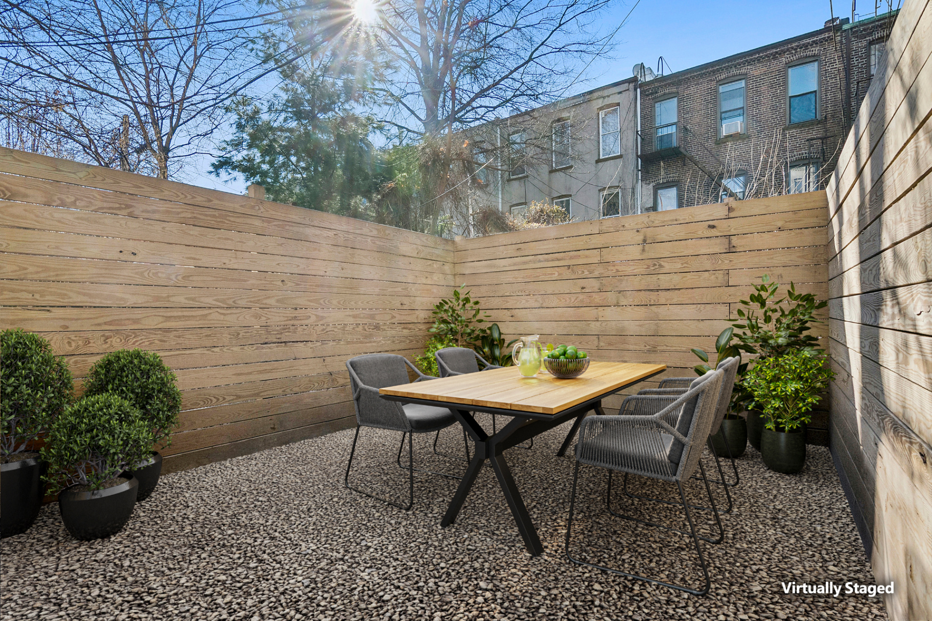 Private backyard with cedar fence and outdoor dining set